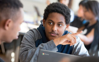 Student-at-computer-with-classmate